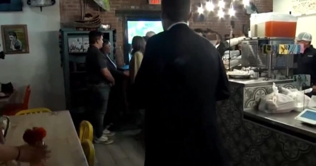 Secret Service Agent Placed Directly in Front of the Cameras to Shield Kamala Harris’s Unscripted Interactions – But Cameras Still Catch Kamala Asking Restaurant Owner a Stupid Question! (VIDEO)