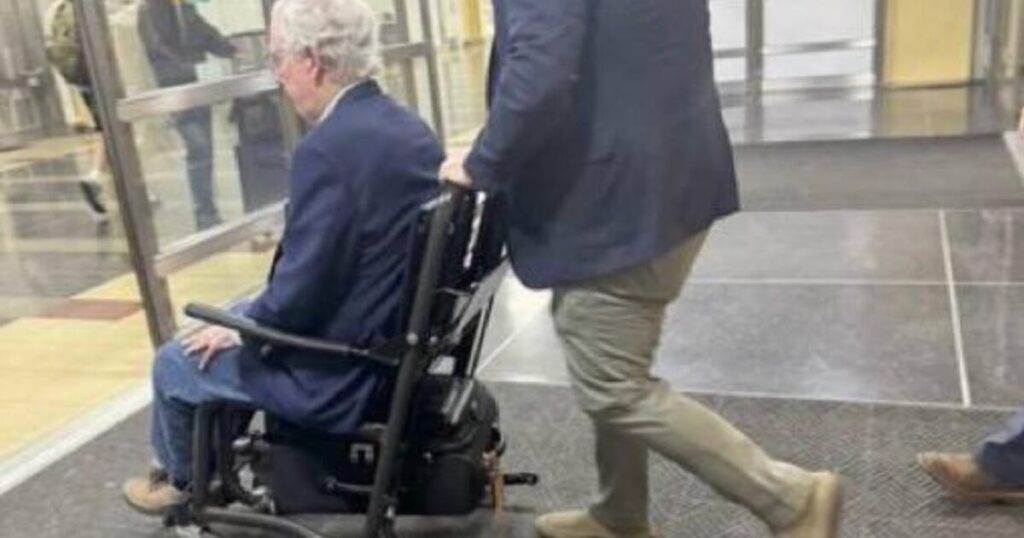 McConnell Photographed in Wheelchair at DCA Airport Amid Alarming Health Scares