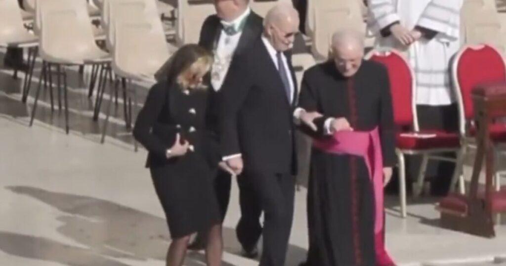 Joe Biden’s Death Grip on Priest’s Arm as He Walks Down Steps at Pope’s Funeral is Something Else (VIDEO)