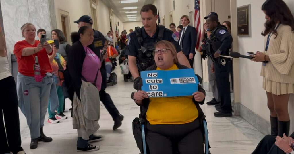 “THIS IS THE HOLOCAUST ALL OVER AGAIN” — Disabled Protester with Soros-Backed Group Screams “They Want to Kill The Disabled” as She is Arrested for Obstructing House Hearing