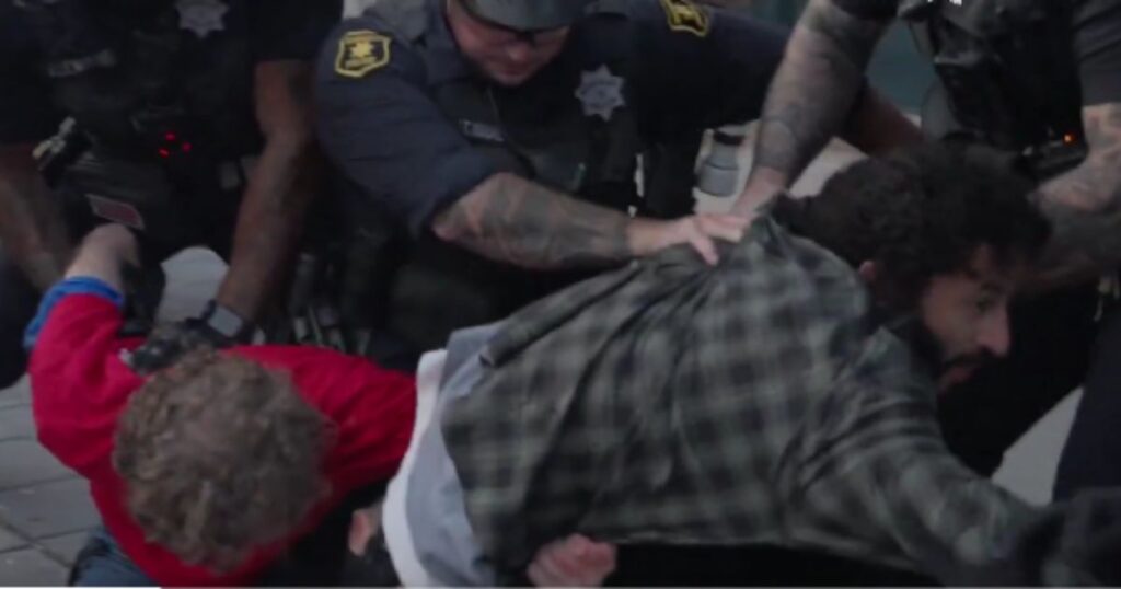 Commie Group at UC Berkeley Campus Displays Poster Depicting President Trump As Hitler