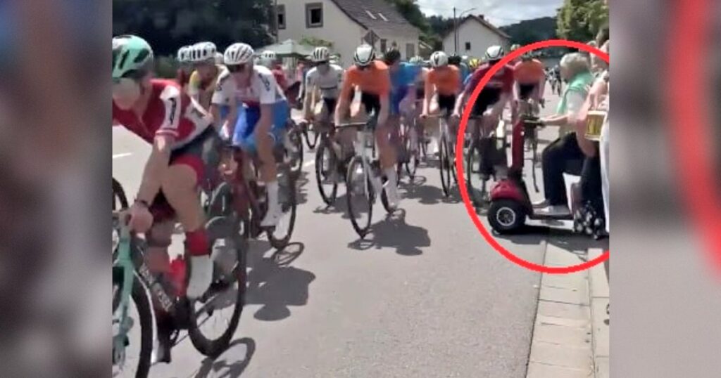 SHOCK VIDEO: Clueless Pensioner Rides Her Mobility Scooter in the Path of Racing Cyclists, Sends Them Flying