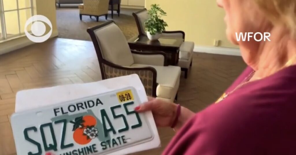 (VIDEO) Florida Woman Shocked When DMV Sends Her a Cheeky “SQZ A55” License Plate – “I Looked at it, and Said I Don’t Think So”
