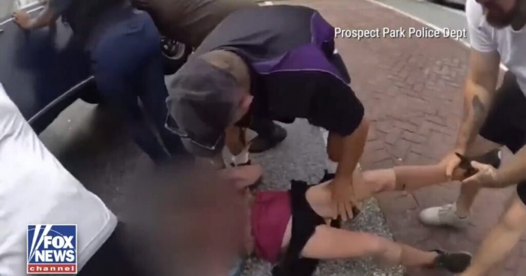 Heroic Bystanders Rescue Woman Trapped Under Car Following E-Bike Crash (VIDEO)